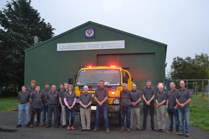 The Lauriston volunteer fire brigade together outside the Lauriston fire house.