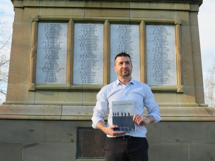 Reon Blake with his book The Foothills Fallen